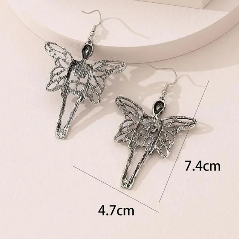 Boucles d'oreilles pendantes fée squelette avec ailes de papillon et tête de mort