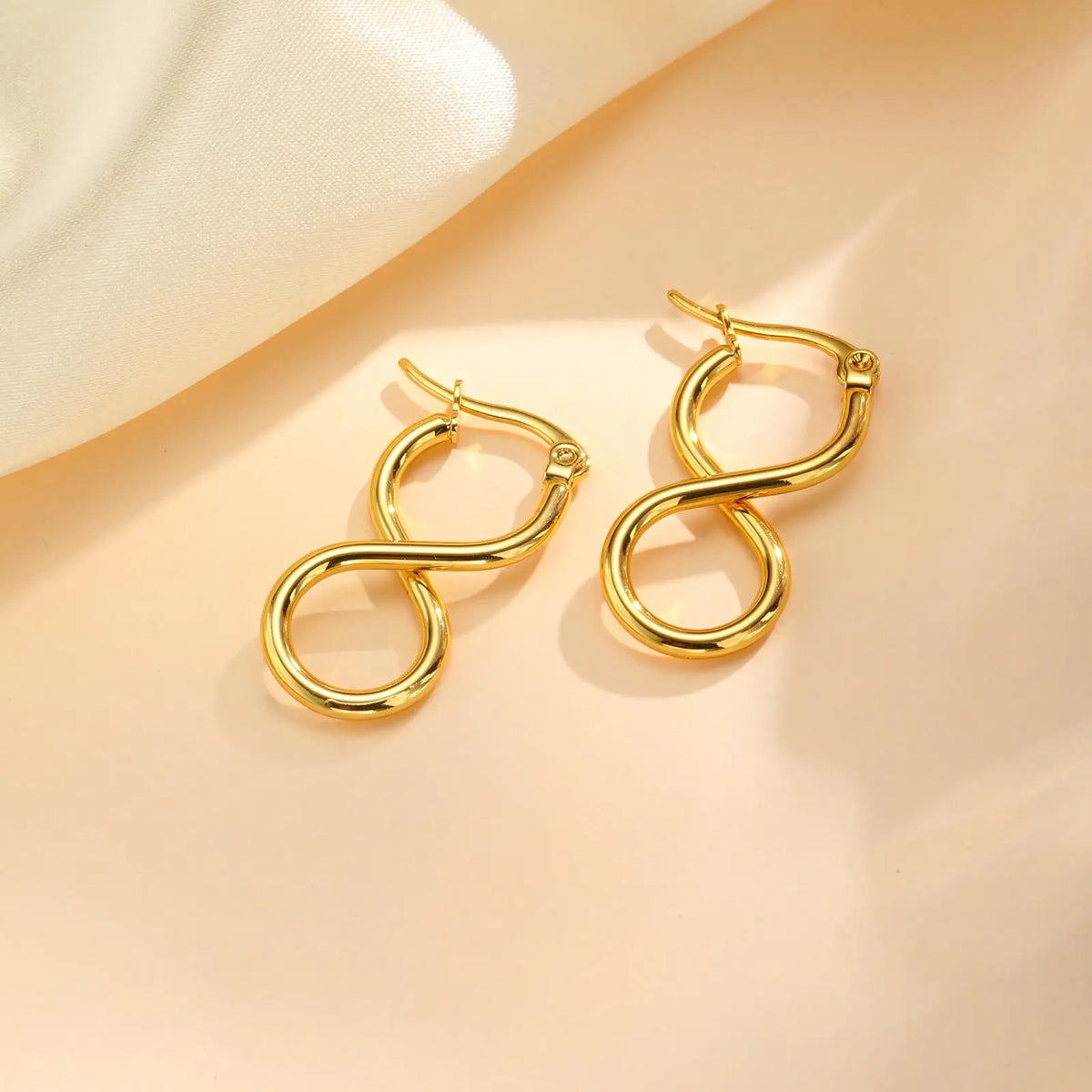 Boucles d'oreilles pendantes symbole infini géométrique 