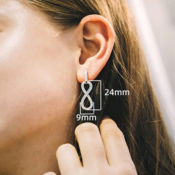 Boucles d'oreilles pendantes symbole infini orné de strass