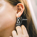 Boucles d'oreilles pendantes symbole infini orné de strass