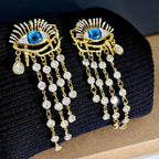 Boucles d'Oreilles Pendantes Oeil Bleu et Strass