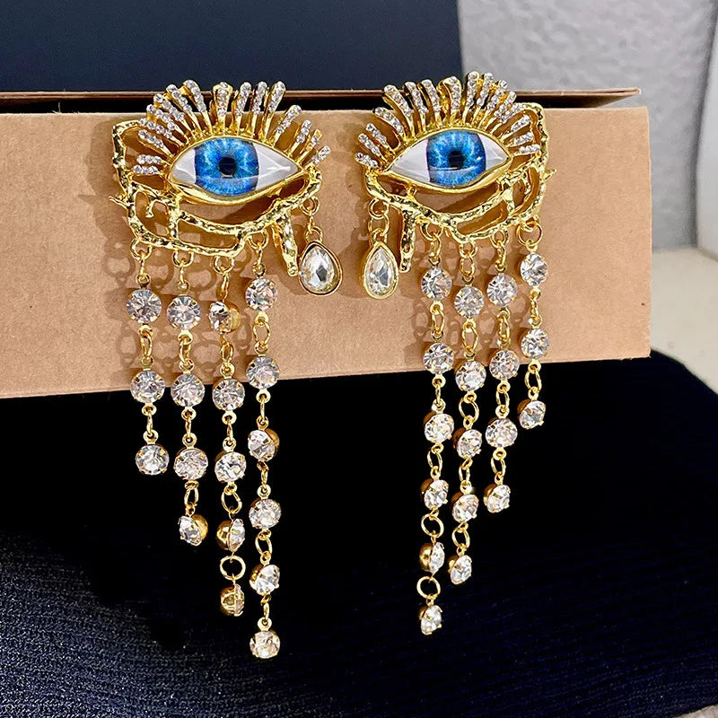 Boucles d'Oreilles Pendantes Oeil Bleu et Strass