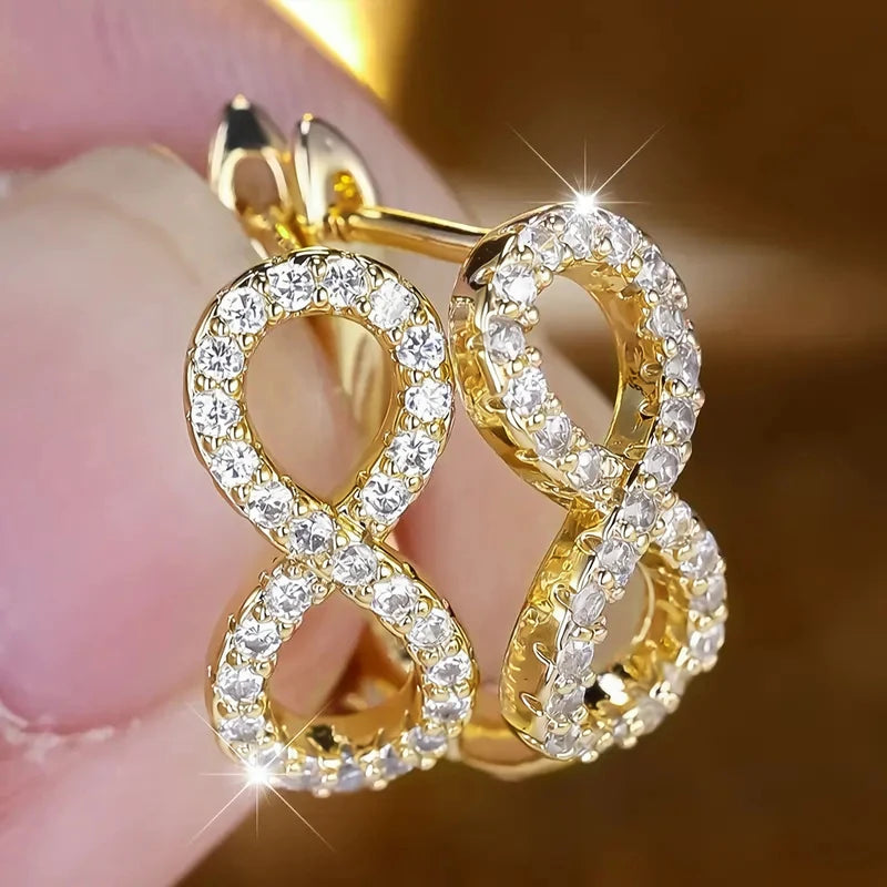 Boucles d'oreilles pendantes symbole infini scintillant or