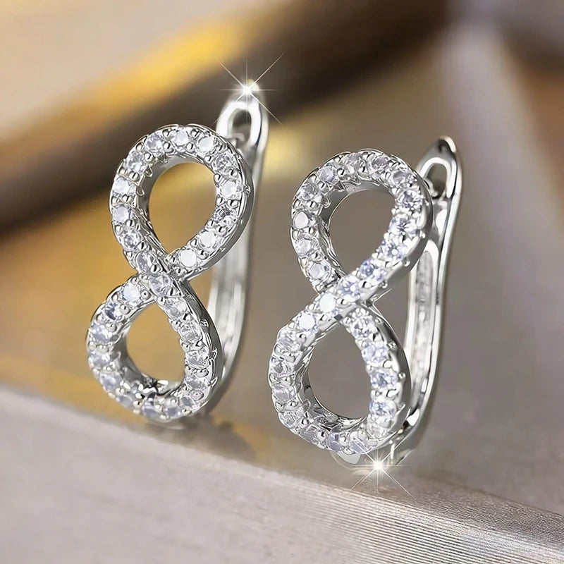 Boucles d'oreilles pendantes symbole infini scintillant argent