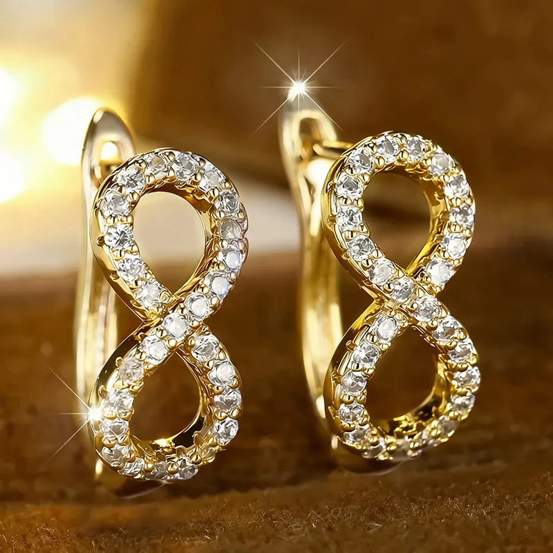 Boucles d'oreilles pendantes symbole infini scintillant or
