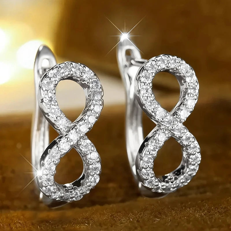 Boucles d'oreilles pendantes symbole infini scintillant argent