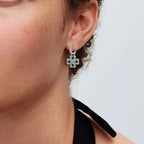 Twisted drop earrings with four-leaf clover