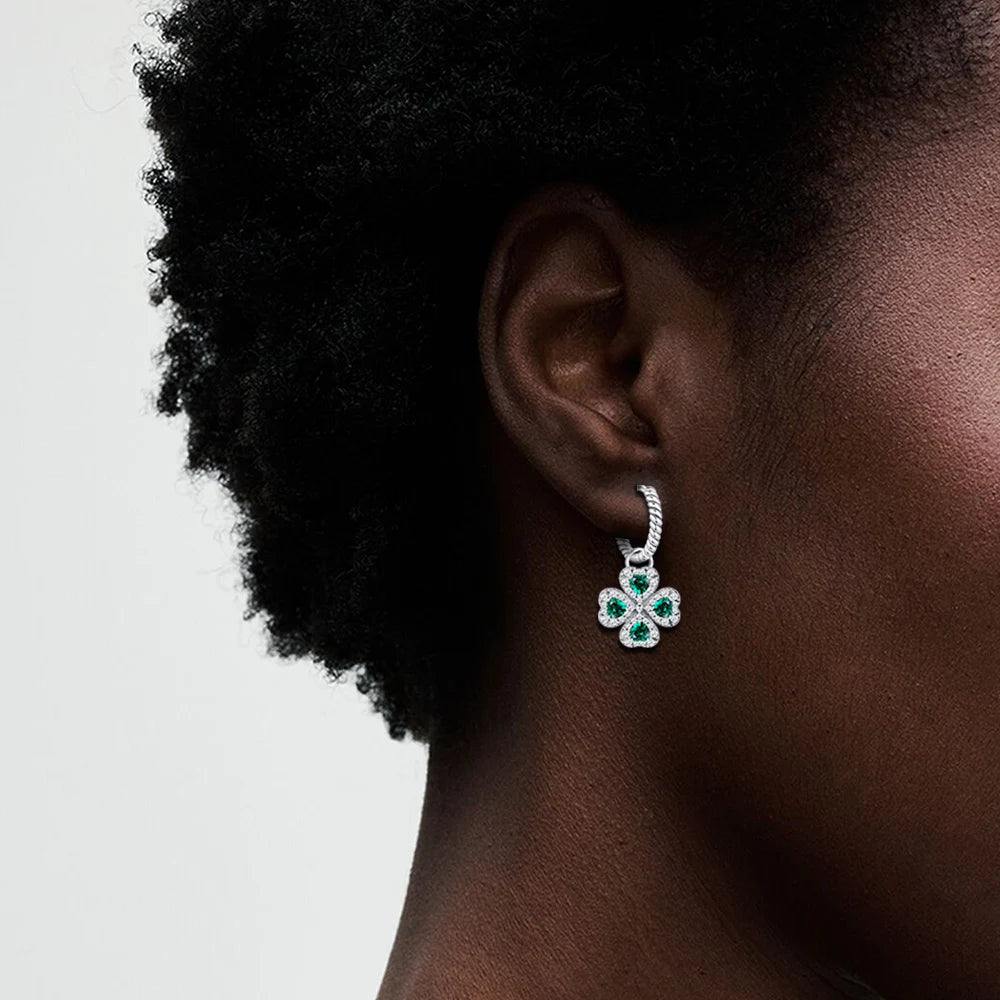 Twisted drop earrings with four-leaf clover