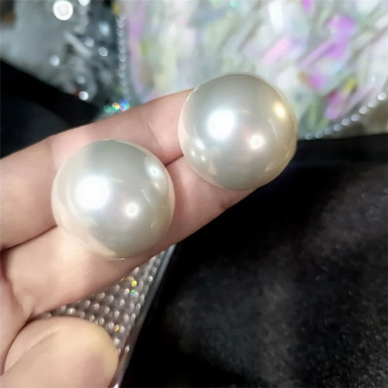 Giant button pearl earrings