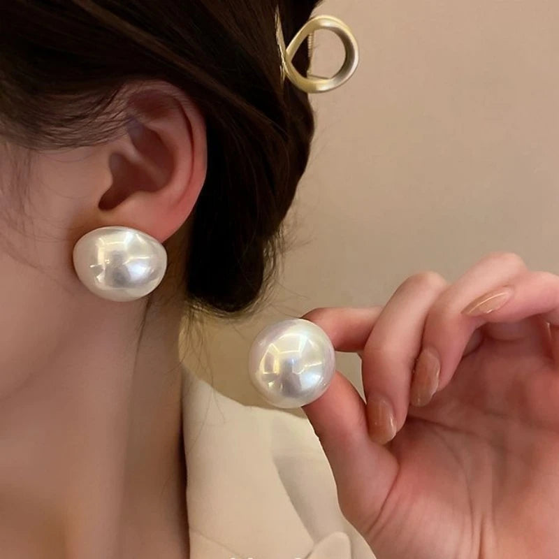 Giant button pearl earrings
