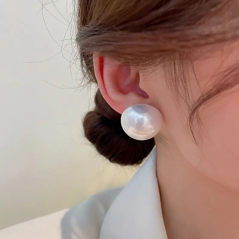 Giant button pearl earrings
