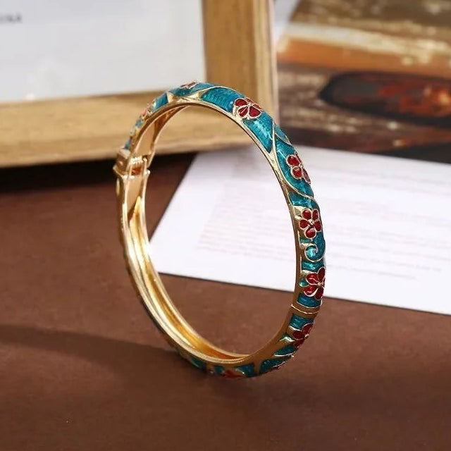 Bracelet à motifs fleurs et feuillages en émail coloré vert d'eau
