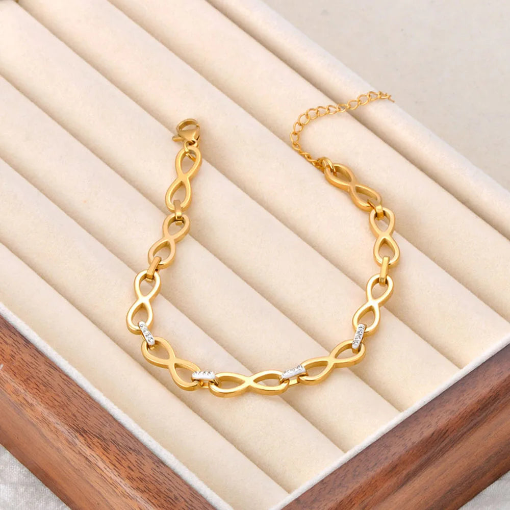 Bracelet avec symboles infini entrelacés or