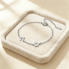 Bracciale regolabile con la <span data-glossary-id="star-of-david">stella di David</span> e i simboli Chai di appartenenza ebraica in argento