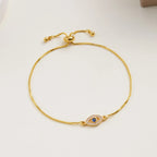 Bracelet ajustable oeil bleu orné de strass