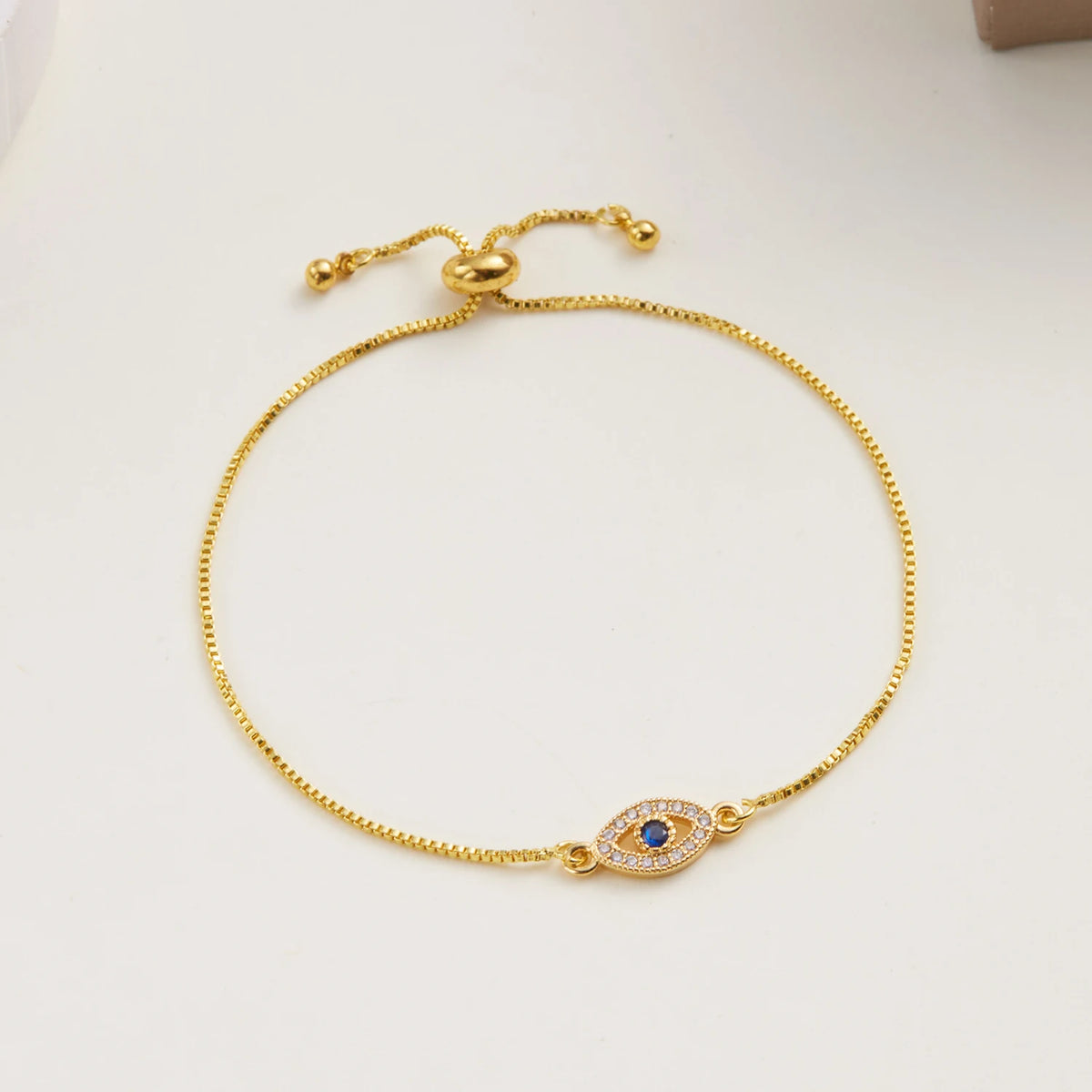 Bracelet ajustable oeil bleu orné de strass