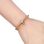 Perlen-Kordelarmband mit Totenkopf aus mystischen Strasssteinen in Gold