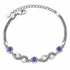 Bracelet avec perles violettes et symboles infinis ornés de cristaux 