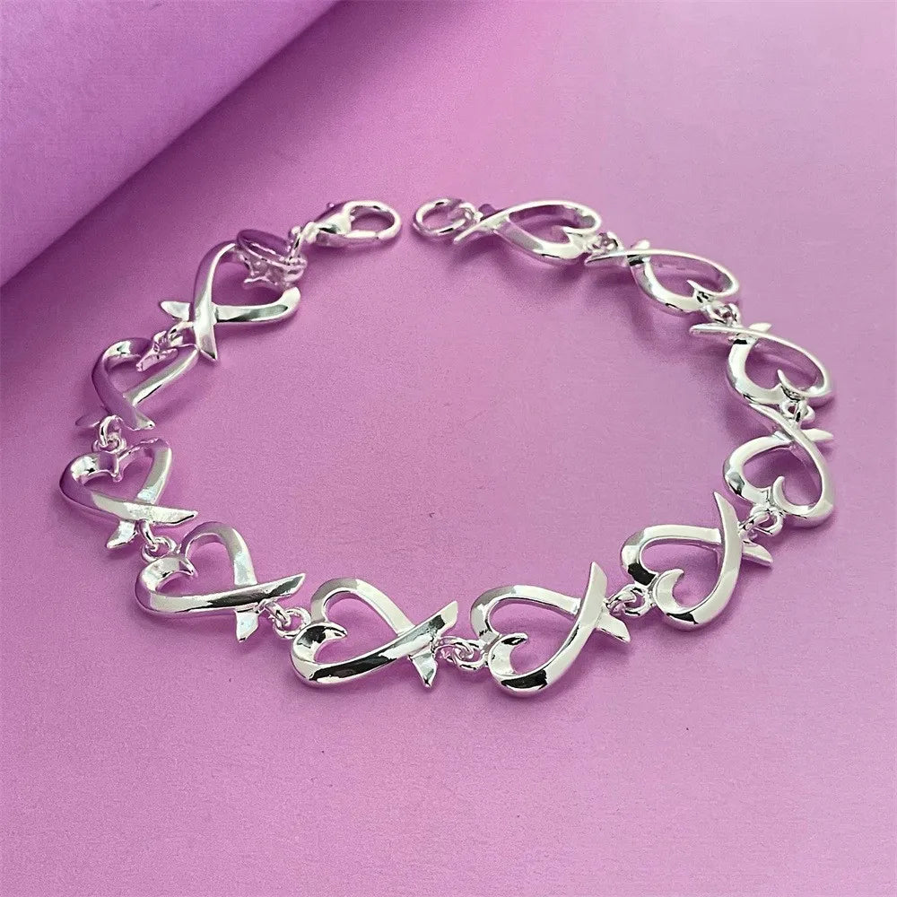 Bracelet avec symboles infini en forme de coeur