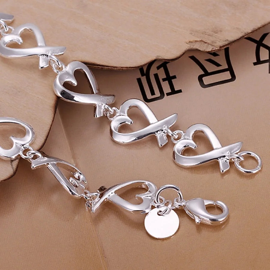 Bracelet avec symboles infini en forme de coeur