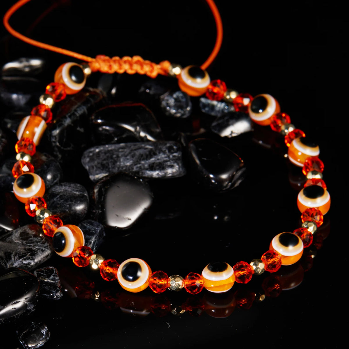 Bracelet cordon avec multiples perles oeil bleu protecteur orange