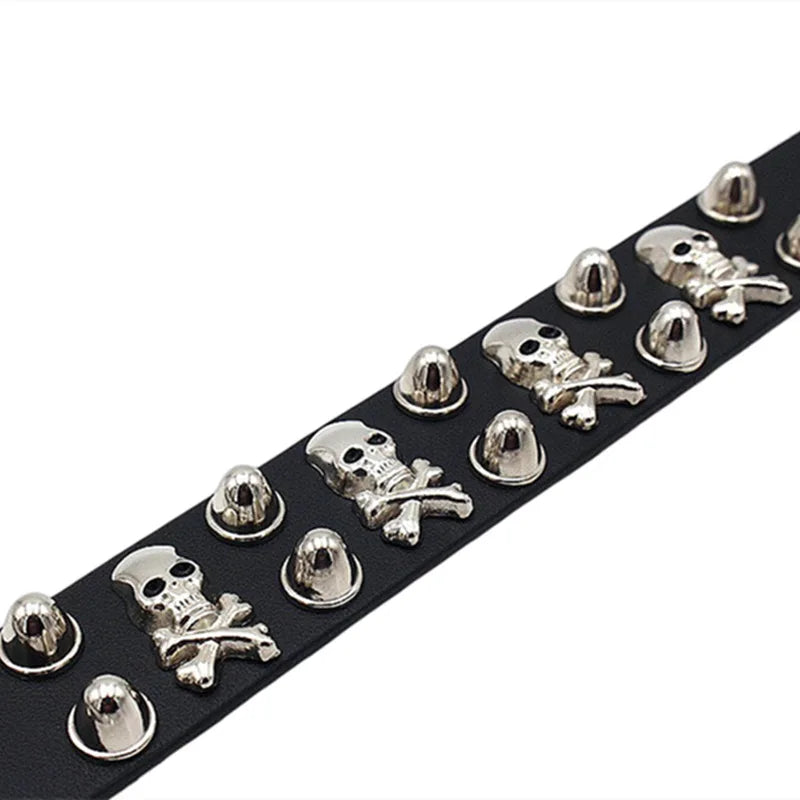 Leather bracelet adorned with skulls and spikes