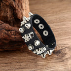 Leather bracelet adorned with skulls and spikes