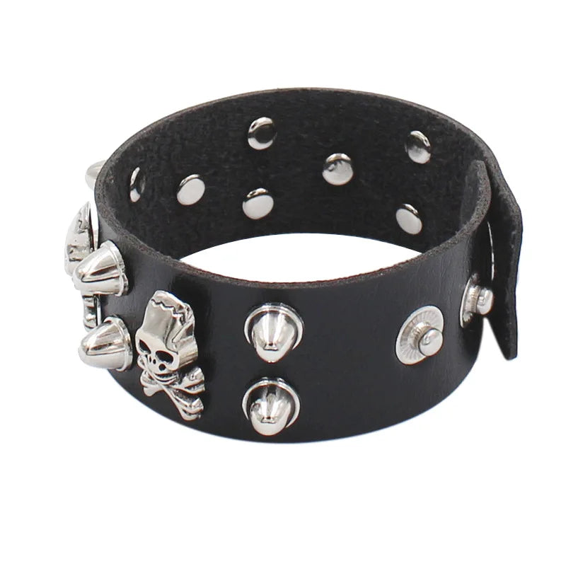 Leather bracelet adorned with skulls and spikes