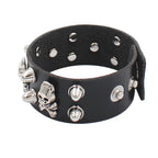 Leather bracelet adorned with skulls and spikes