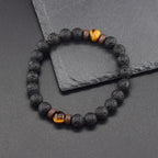 Bracciale di protezione in pietre laviche e perle di occhio di tigre