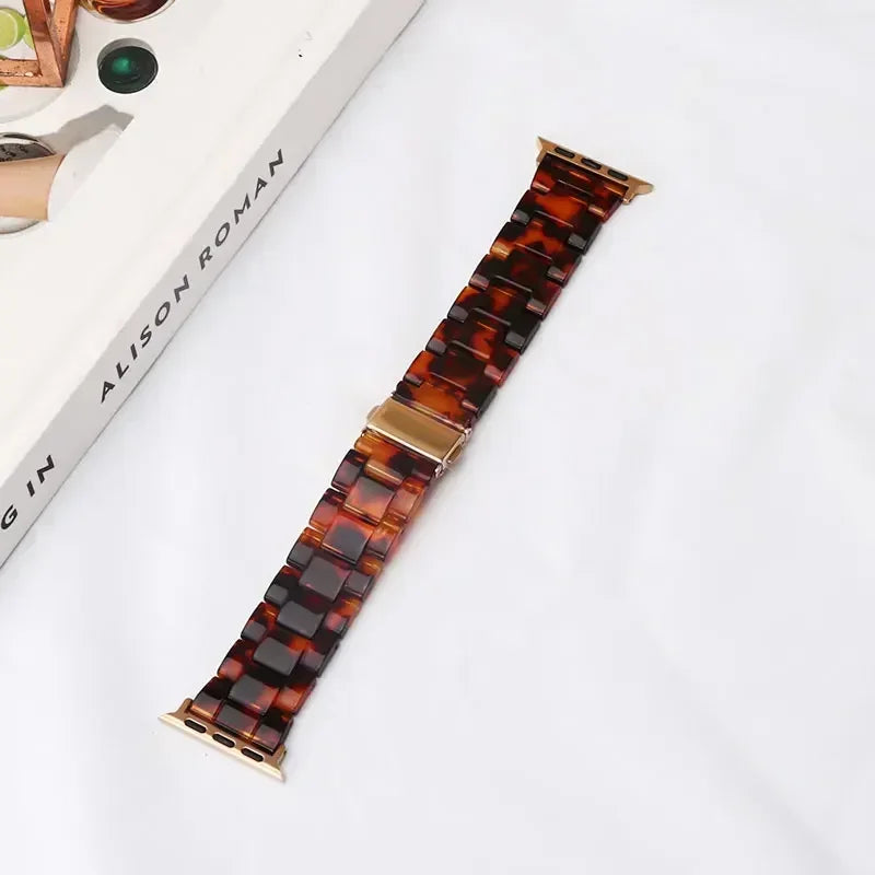 Ersatzarmband für die Apple Watch aus braunem und goldenem Harz