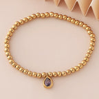 Bracelet doré avec pierre de naissance pour femme