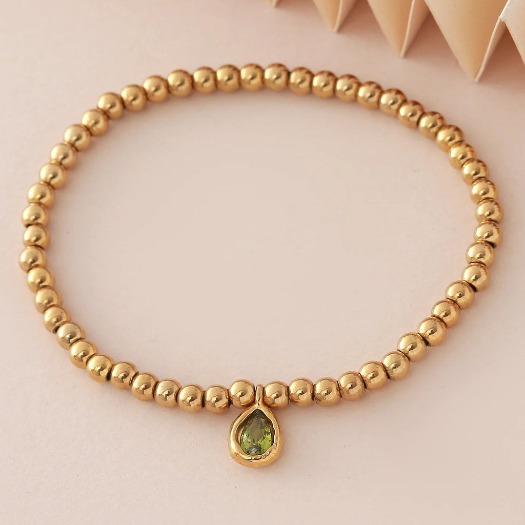Bracelet doré avec pierre de naissance pour femme