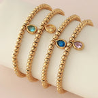 Bracelet doré avec pierre de naissance pour femme
