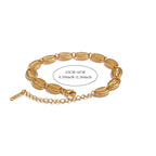 Bracciale dorato con conchiglia cauri