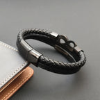 Multi-strand braided leather bracelet with infinity symbol