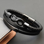 Multi-strand braided leather bracelet with infinity symbol