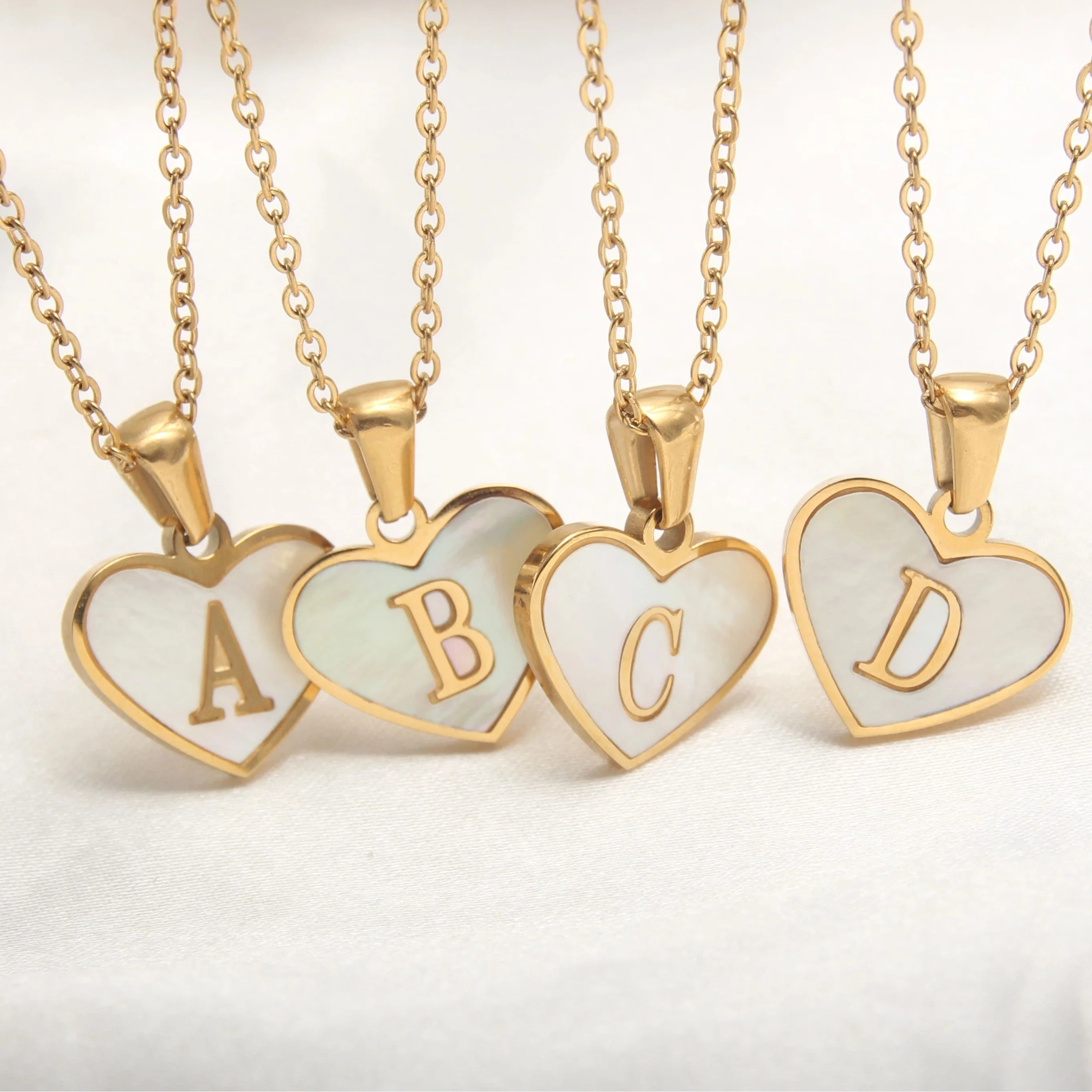 Necklace with white heart pendant initial