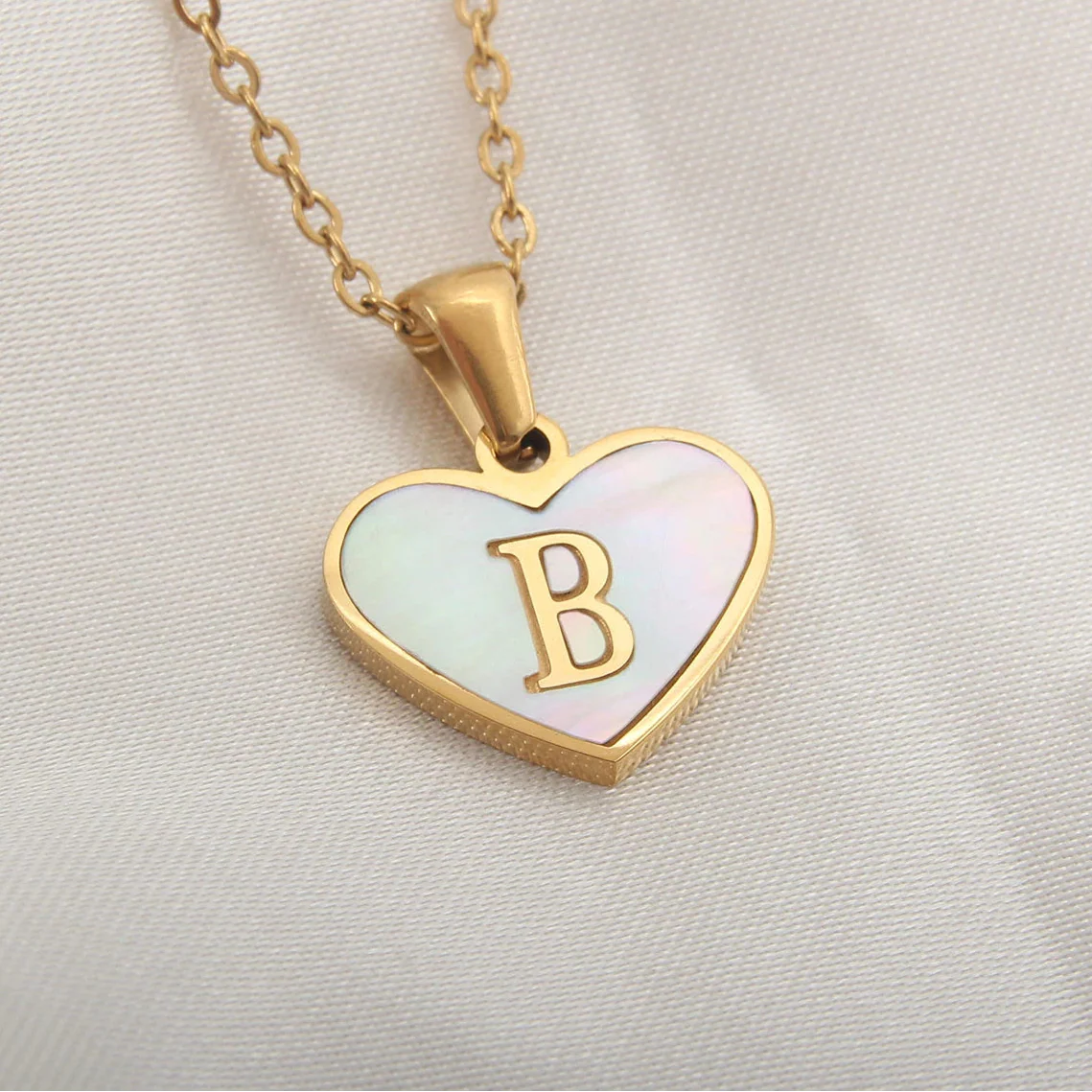 Necklace with white heart pendant initial b