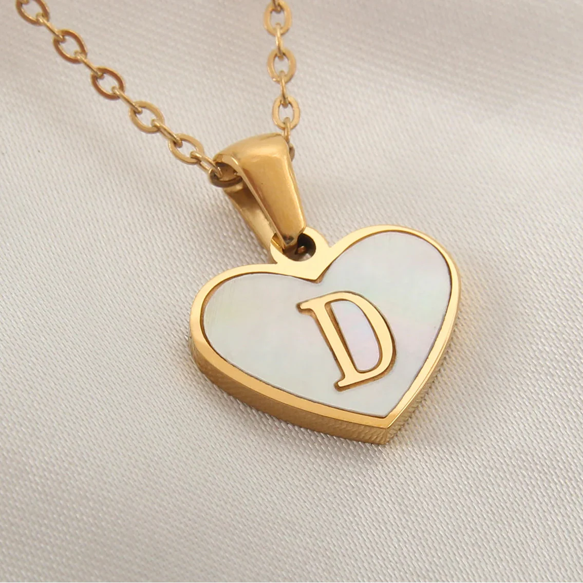 Necklace with white heart pendant initial d