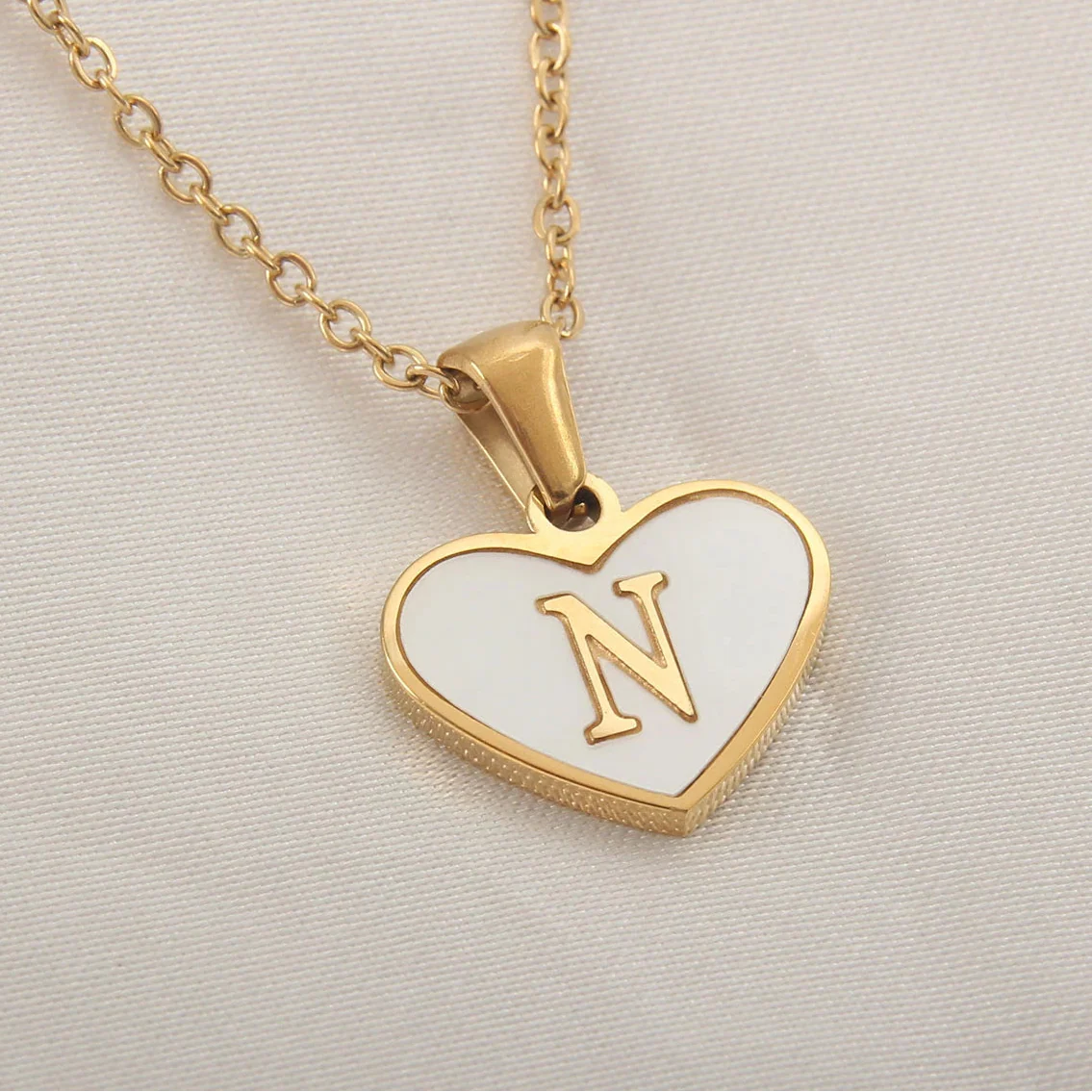 Necklace with white heart pendant initial n