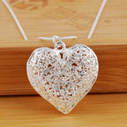 Necklace with heart pendant and foliage