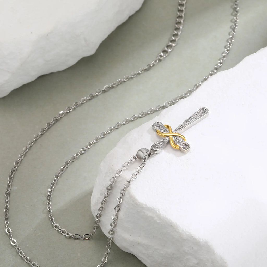 Collier avec pendentif croix et symbole infini bicolore