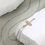 Collier avec pendentif croix et symbole infini bicolore