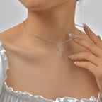 Collier avec pendentif croix et symbole infini bicolore