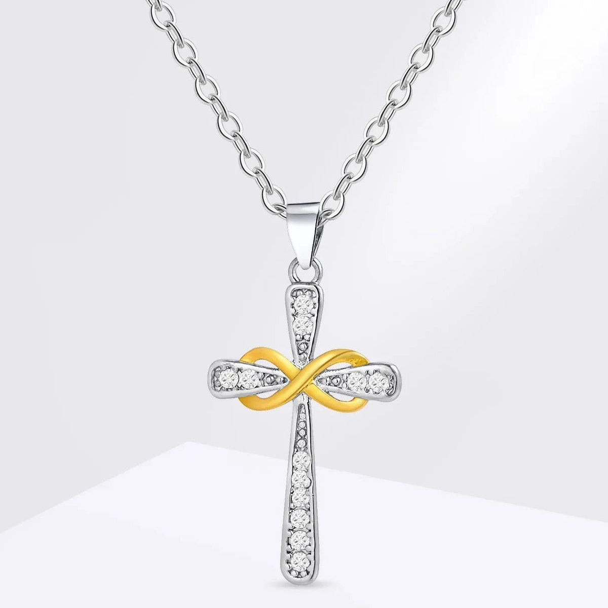 Collier avec pendentif croix et symbole infini bicolore