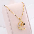 Ketting met hanger "hemelse eclips" halve maan en strass