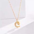 Ketting met hanger "hemelse eclips" halve maan en strass