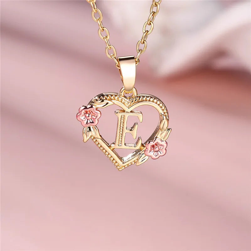 Necklace with heart and flowers initial pendant e