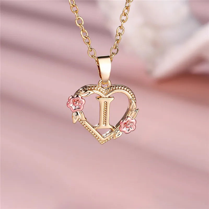 Necklace with heart and flowers initial pendant i